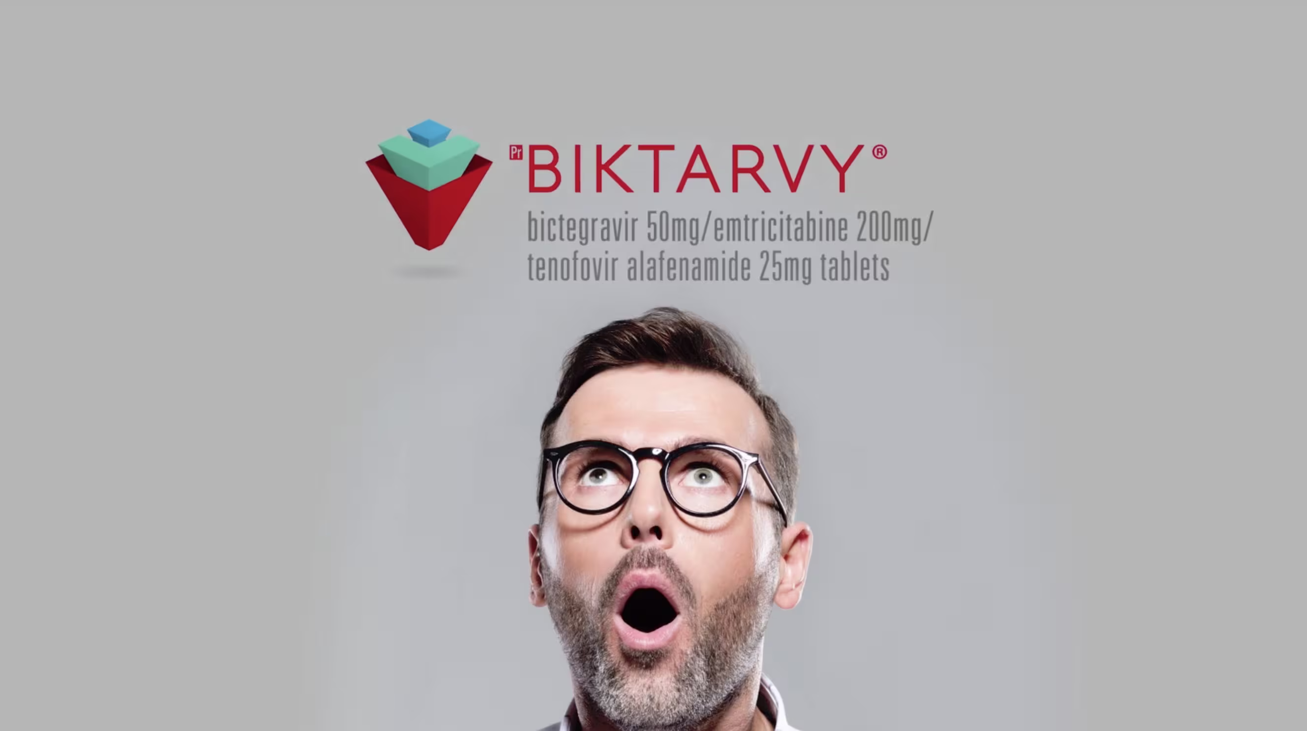 Man with glasses looking upward with surprised expression beside Biktarvy medication branding.