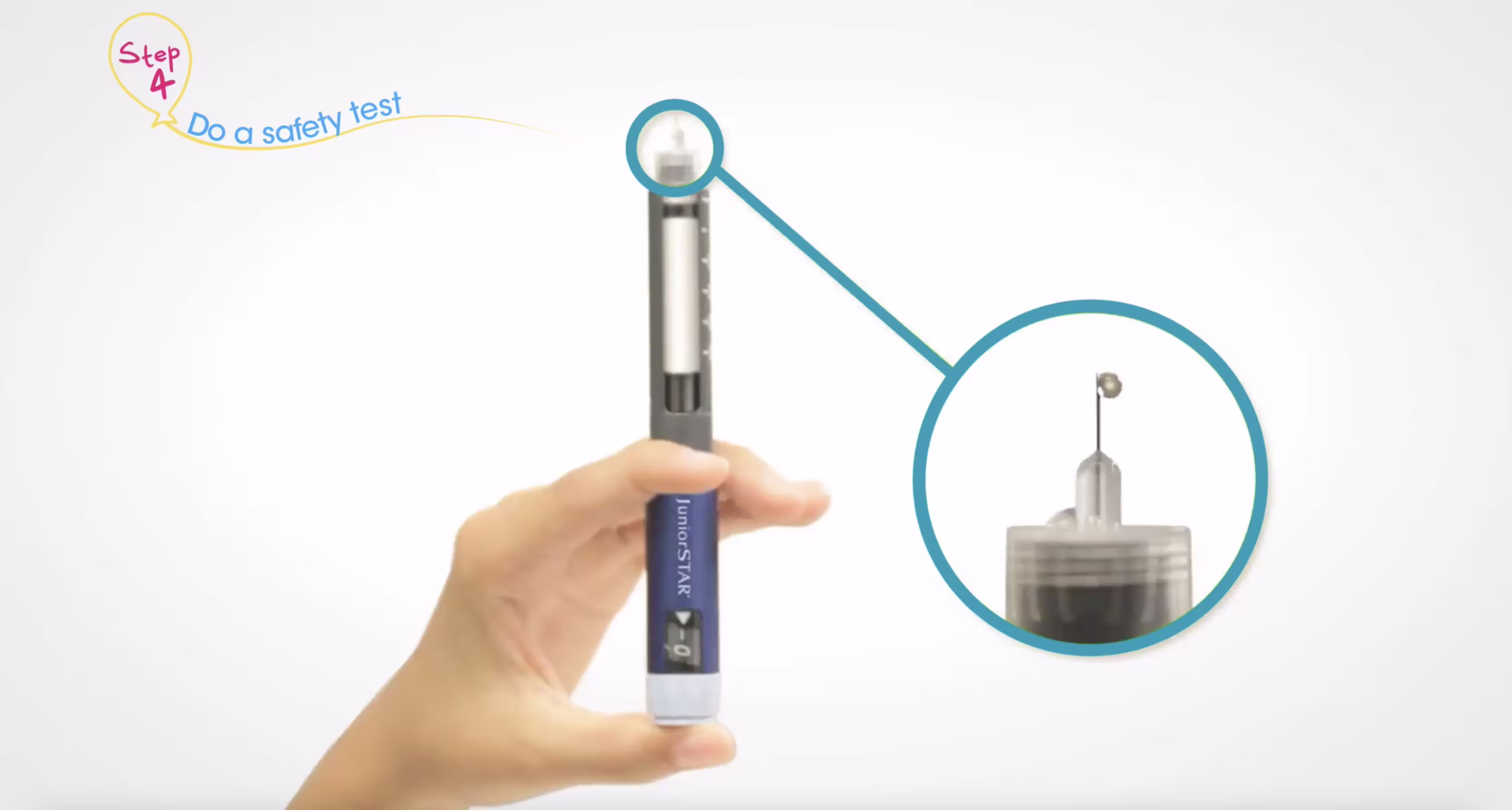 Hand holding an insulin pen with a magnified inset showing the attached needle tip.